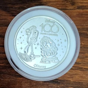 *Moneda y estuche Lumiere Cogsworth* medallón de plata 100 años de maravilla del parque Disney - Imagen 1 de 3