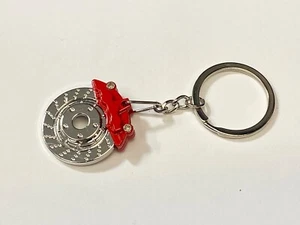 Llavero con almohadilla de ruptura de disco rojo piezas de automóviles camión - envío rápido a EE. UU. - Imagen 1 de 6