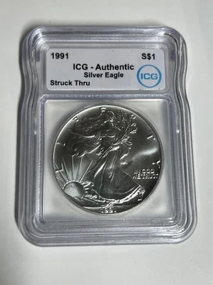 1991 ICG Authentic Silver Eagle Strike-Through Error - Image 1 of 4