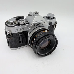 Cámara fotográfica Canon AE-1 35 mm plateada con FD 50 mm 1:1,8 S.C. Lente sin probar  - Imagen 1 de 19