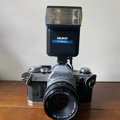 Canon AE-1 35mm Film SLR Camera (Silver) + FD 50mm f/1.4 Lens - Tested, Working - Image 1 of 4