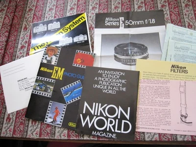 9 Pc Bundle of Genuine Nikon System Brochures Guides Lenses Cards Warranties - Image 1 of 4