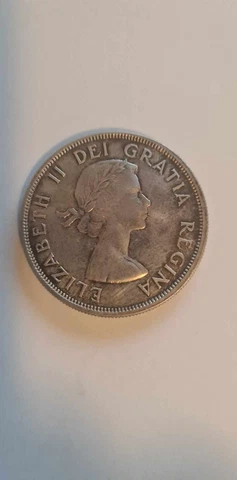 1960 Canadian Silver Dollar, Very Good condition. Kept in a safe 40+ years Cover