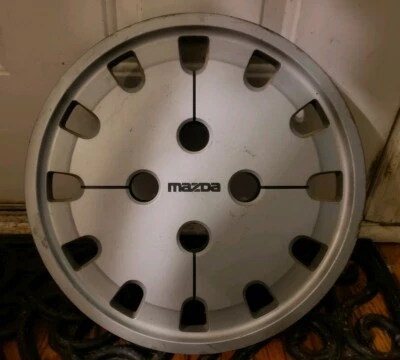 (1) Cubierta de rueda tapacubos OEM 1986-1987 Mazda 323 626 14" p/n G-120 716781-0010 Foto 1 de 4