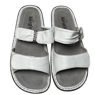 Sandalias Alegria de cuero blanco deslizables 37 EE. UU. 7 suela de mariposa cómoda Foto 1 de 4