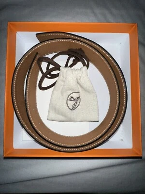 Correa de cuero reversible Hermes 32 mm, negro/oro. Cinturón talla 85. Hebilla de cinturón Quizz Foto 1 de 4