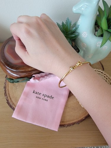 Bracciale Kate Spade New York con fiocco in oro