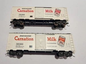 Fleischmann H0 - 2 vagones de mercancías estadounidenses "Carnation Milk" C.M.25003 - Imagen 1 de 8
