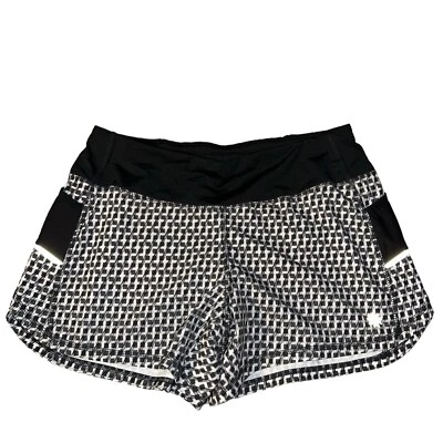 Pantalones cortos para mujer Athleta blancos y negros Run with it 4” talla pequeña Foto 1 de 4