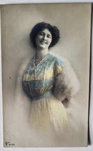 C 1907 HAND-COLORED RPPC SMILING YOUNG WOMAN BLUE & YELLOW DRESS WHTE FUR STOLE - Picture 1 of 2