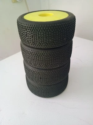 1/8 AKA Impact Medium Long Wear on Yellow WHEELS - Image 1 of 3