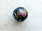 BEAUTIFUL ANTIQUE  ROUND BLACK GLASS TRADE BEAD W/  PINK FLOWERS & YELLOW LEAVES