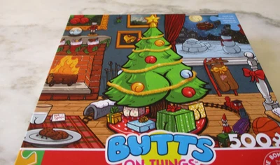 Ceaco 500 Piece Brian Cook Art Puzzle "Butts on Things" Christmas 21.25" x 15" - Image 1 of 3