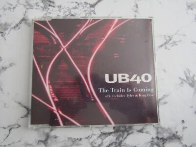 CD SINGLE - UB40 - THE TRAIN IS COMING - CD2 includes Tyler & King Live - Image 1 of 2