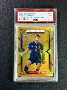 2022-23 Panini Ossidiana William Saliba Incisione Elettrica Gold Flood /10 RC PSA 7 - Foto 1 di 2