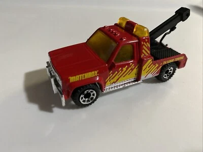 Matchbox 1987 GMC Wrecker Tow Truck Red w/Yellow/White Livery & Logo Grille (mc1 - Image 1 of 4