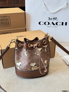 NWT Coach X Peanuts Mini Bucket Bag Signature Canvas Snoopy Print OUTLET - Picture 1 of 6