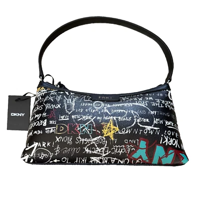 Bolso de mano DKNY Carlita EW Baguette negro y estampado de graffiti imitación cuero para mujer Foto 1 de 4