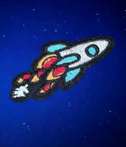LAUNCHING MINI ROCKET SHIP OUTER SPACE COSMOS ART IRON ON PATCH 2.25 X 1 INCHES - Picture 1 of 6