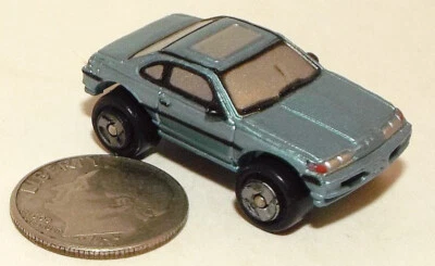 Small Micro Machine Plastic 1990's style Ford Mustang Coupe in Light Blue - Image 1 of 4