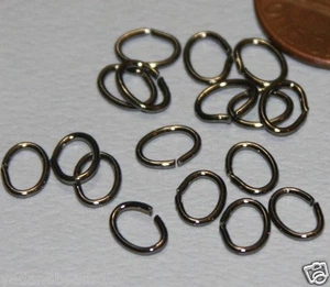 100 piezas de saltador ovalado chapado en metal de pistola calibre 22 7X5mm - Imagen 1 de 1