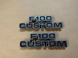 73-79 Ford Truck F100 Custom Metal Emblems Pair OEM 1973-1979 - Picture 1 of 3