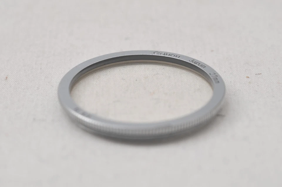 @ SakuraDo Camera @ Rare! @ Vintage Canon UV 1x 27mm Chrome Screw-In Lens Filter - Image 1 of 4