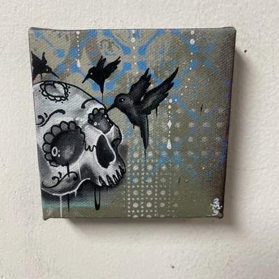 Calavera de azúcar y colibríes negros pintura graffiti arte tatuaje arte arte extraño Foto 1 de 4
