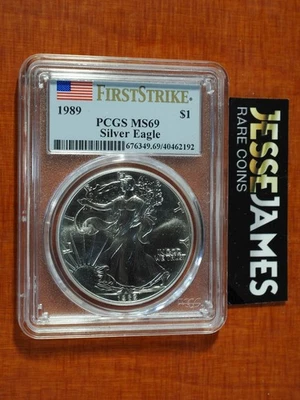 1989 $1 AMERICAN SILVER EAGLE PCGS MS69 FLAG FIRST STRIKE LABEL - Image 1 of 2