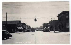 MAIN STREET NORWAY MICHIGAN RPPC POSTCARD CARS BUS SIGNS CIRCA 1950 - Picture 1 of 2