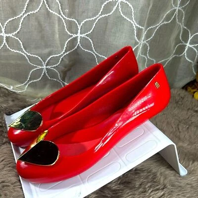 (S1) Mel by Melissa Space LoveSpecial flat sneakers with red and gold heart. S/9 - Image 1 of 4