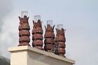 Photo 6x4 four matching chimney pots Tiverton/SS9512 red louvred clay ch c2011