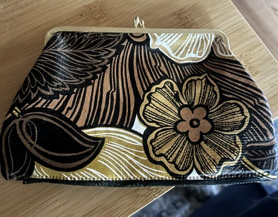 Vintage clutch purse with snap close on one side and zippered compartment other - Image 1 of 4