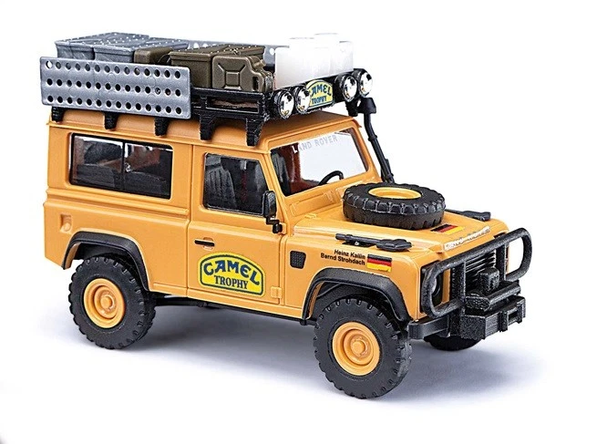 Busch 54311 - H0 - Land Rover Defender 90 Camel Trophy 1985, Germania - Nuovo - Immagine 1 di 1