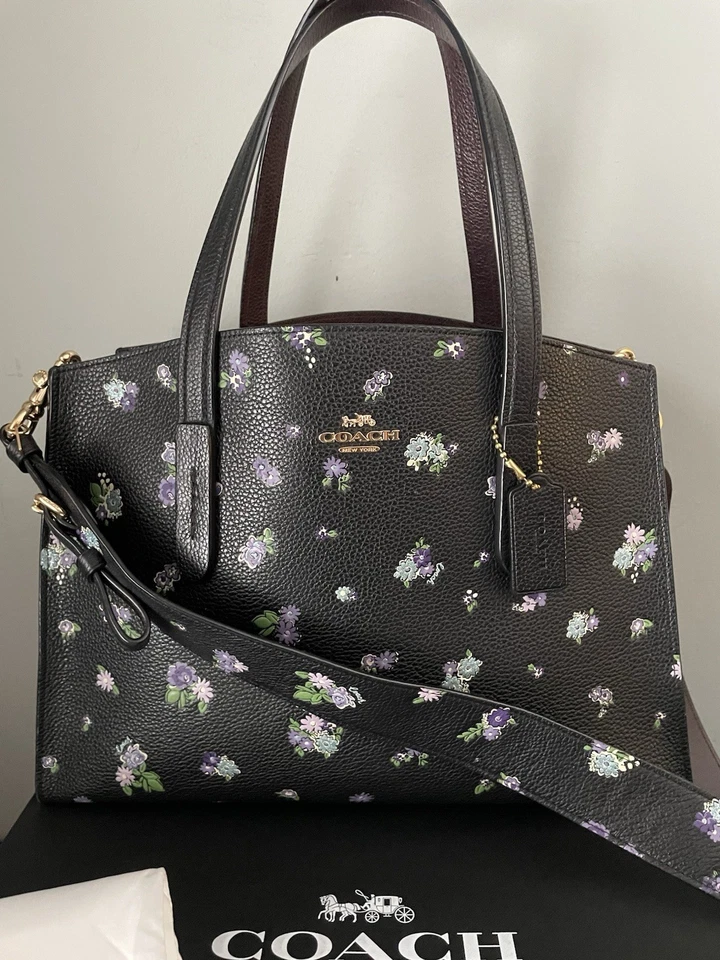 Bolso Bandolera COACH Charlie Carryall Negro Floral Cuero Repujado Púrpura Posey Foto 1 de 4