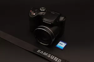 Samsung WB100 Compact Bridge Digital Camera 16.2MP CCD 26x Zoom Black - Picture 1 of 6