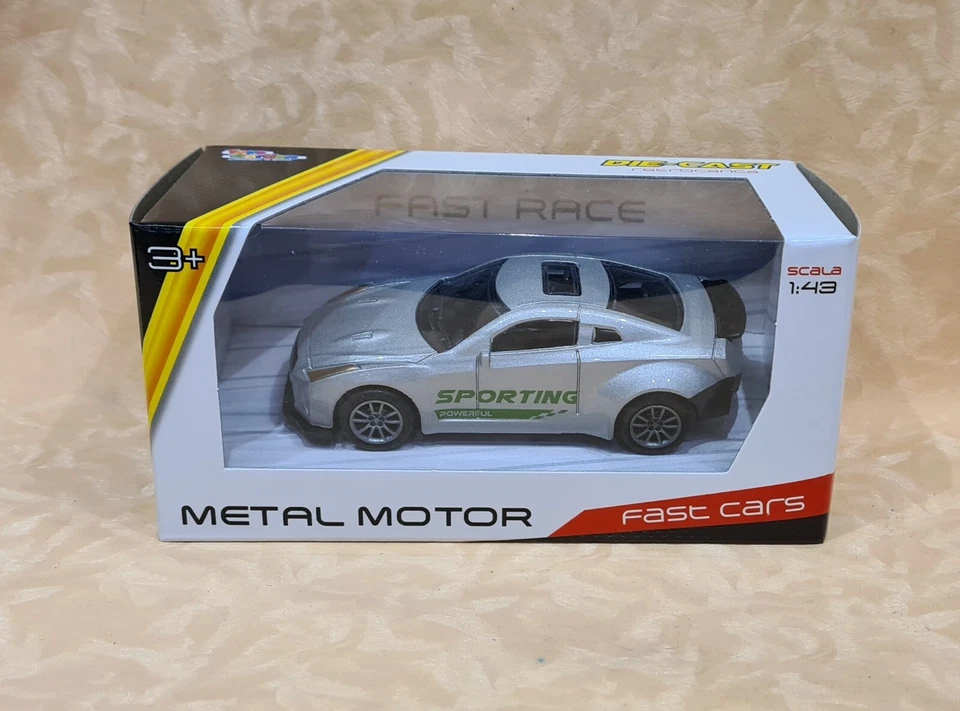 AUTO ARGENTO SCRITTE VERDI MODELLINO IN METALLO SCALA 1:43 RETROCARICA cod.26850 - Immagine 1 di 1