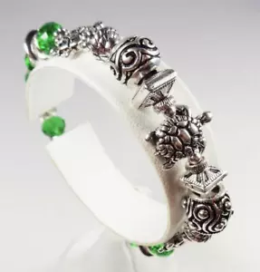 BRACCIALE ELASTICO DECORATIVO PERLINE VETRO VERDE TARTARUGHE MARINE RODIO MODA SPIAGGIA - Foto 1 di 7