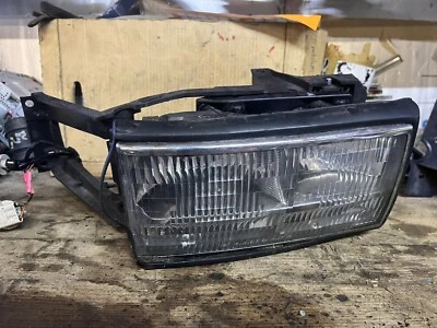 FAROL CADILLAC DEVILLE E SUPORTE DE MOLDURA LADO DO PASSAGEIRO 1994-1996 - Imagem 1 de 4