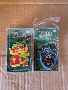 The Legend of Zelda Rubber Offical Key Chains Pixelated Link & Hylian Shield NEW - Picture 1 of 5
