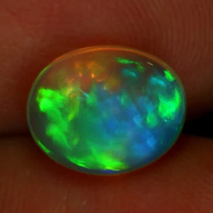 Splendido opale di fuoco arcobaleno naturale Etiopia colore arcobaleno ovale 9,6 x 7,8 mm 1,80 ct - Foto 1 di 5