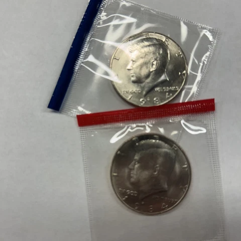 1984 P&D Kennedy Half Dollars from Mint Set in Mint Cello with Free Shipping Cover