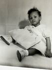 Vintage African American Snapshot Little Girl Sitting Down On The Photo Posing