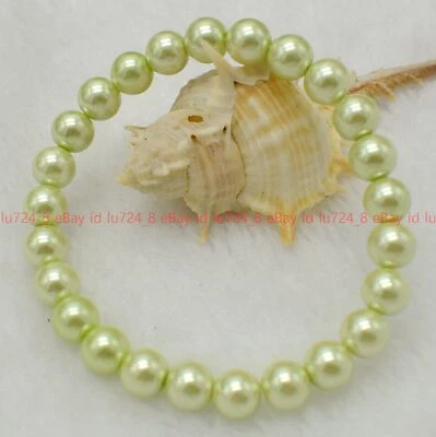 Beautiful 8/10/12mm Green Shell Pearl Elastic Bracelet 7.5" ( Not Real Pearls ) - Image 1 of 4