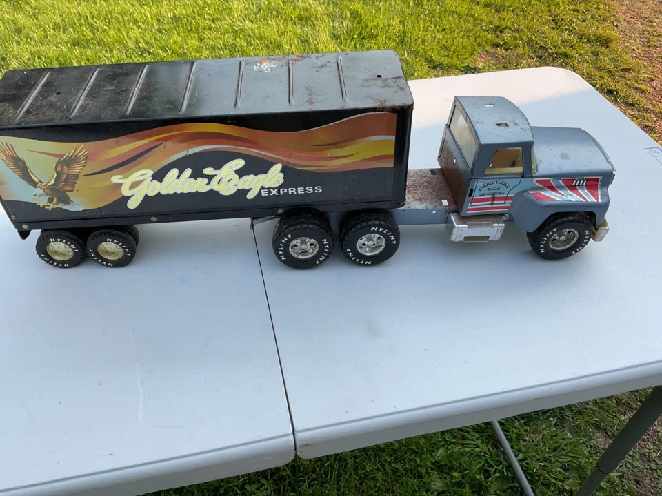 РЕДКАЯ ВИНТАЖНАЯ ИГРУШКА NYLINT GOLD EAGLE EXPRESS ПОЛУПРИЦЕП ПРЕССОВАННАЯ СТАЛЬ - Изображение 1 из 4