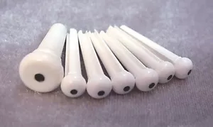SET OF WHITE GUITAR BRIDGE PINS AND A MATCHING ENDPIN - BLACK DOT - Picture 1 of 3