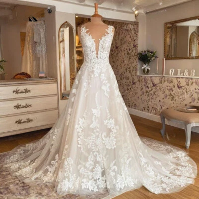 Vestidos de novia blancos boho cuello en V sin mangas apliques de encaje vestidos de novia de playa Foto 1 de 4