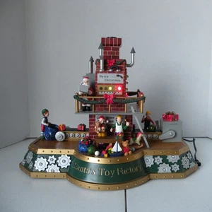 Mr. Christmas Etiqueta Dorada Juguete de Papá Noel Fábrica Musical Animado Decoración con Caja - Imagen 1 de 17