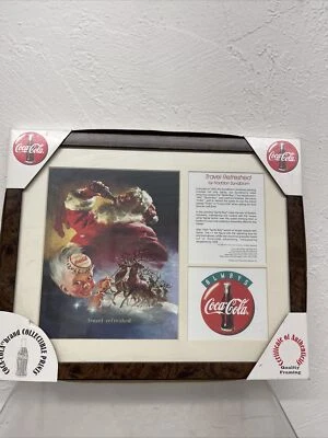 1998 Coca Cola Haddon Sundblom Travel Refreshed Santa & Sprite Boy Framed Print - Image 1 of 4