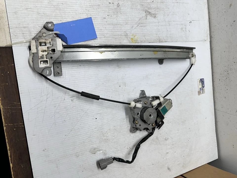 Nissan Pathfinder 1996-2004 puerta del pasajero delantero ventana eléctrica motor regulador S8 Foto 1 de 4